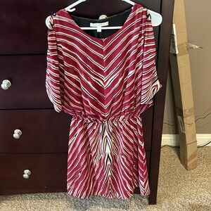 Colorful dress with waist band. Mini length. Can be dressy or a fun night out.